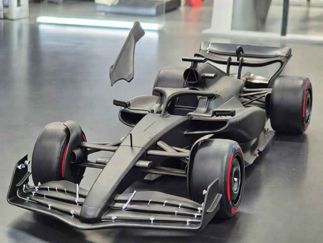 "2026 F1 car prototype showcasing lighter design, shorter wheelbase, narrower body, and active aerodynamics with movable front wing element – new regulations explained"
