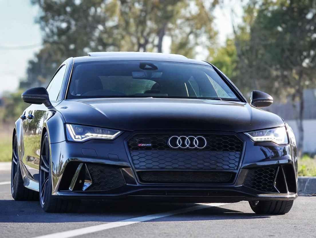 Audi RS7 black 4 door sports car front view, one of the best 4 door sports cars with twin-turbo V8 power and sleek fastback design
