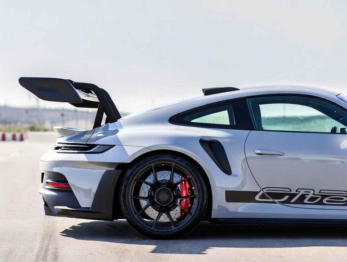 Close-up of 2026 Porsche 911 GT3 RS rear wing and downforce aero package – track performance in the USA