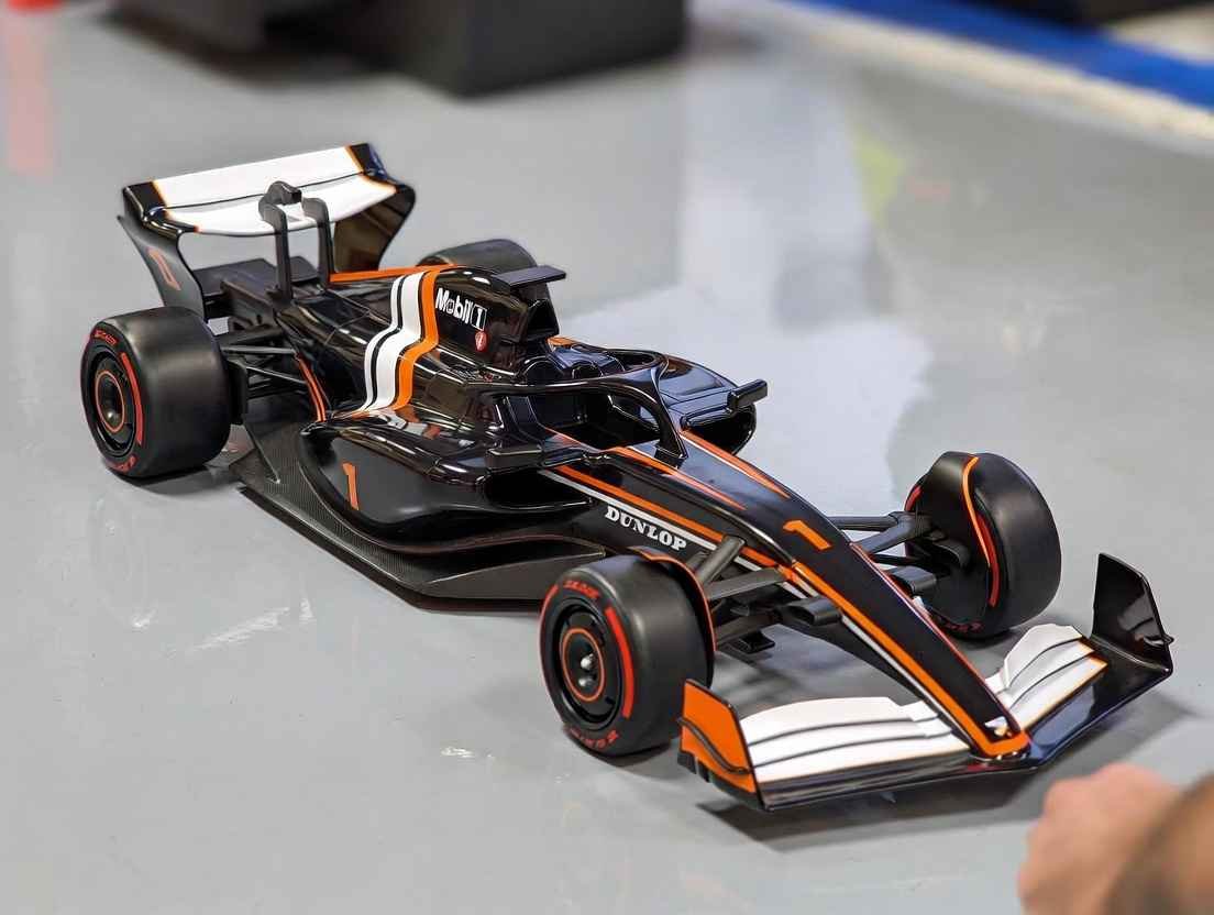 RC F1 Racing Cars black and orange model with Mobil 1 livery on indoor track showcasing speed and realism in 2026